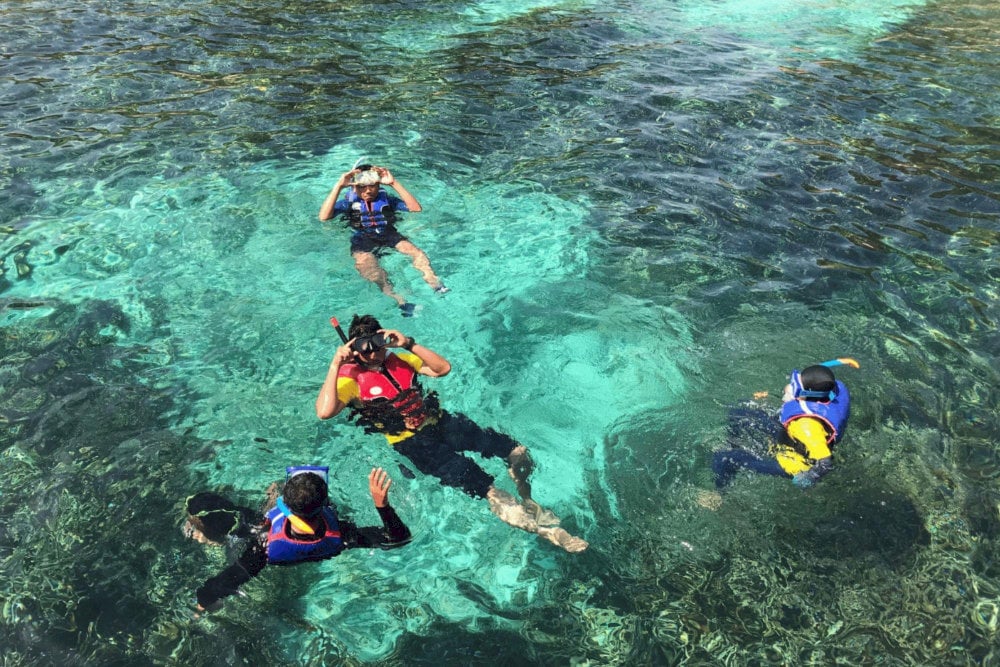 Swimming and snorkeling are favorite activities for visitors at Bai But and Bai Dai beaches